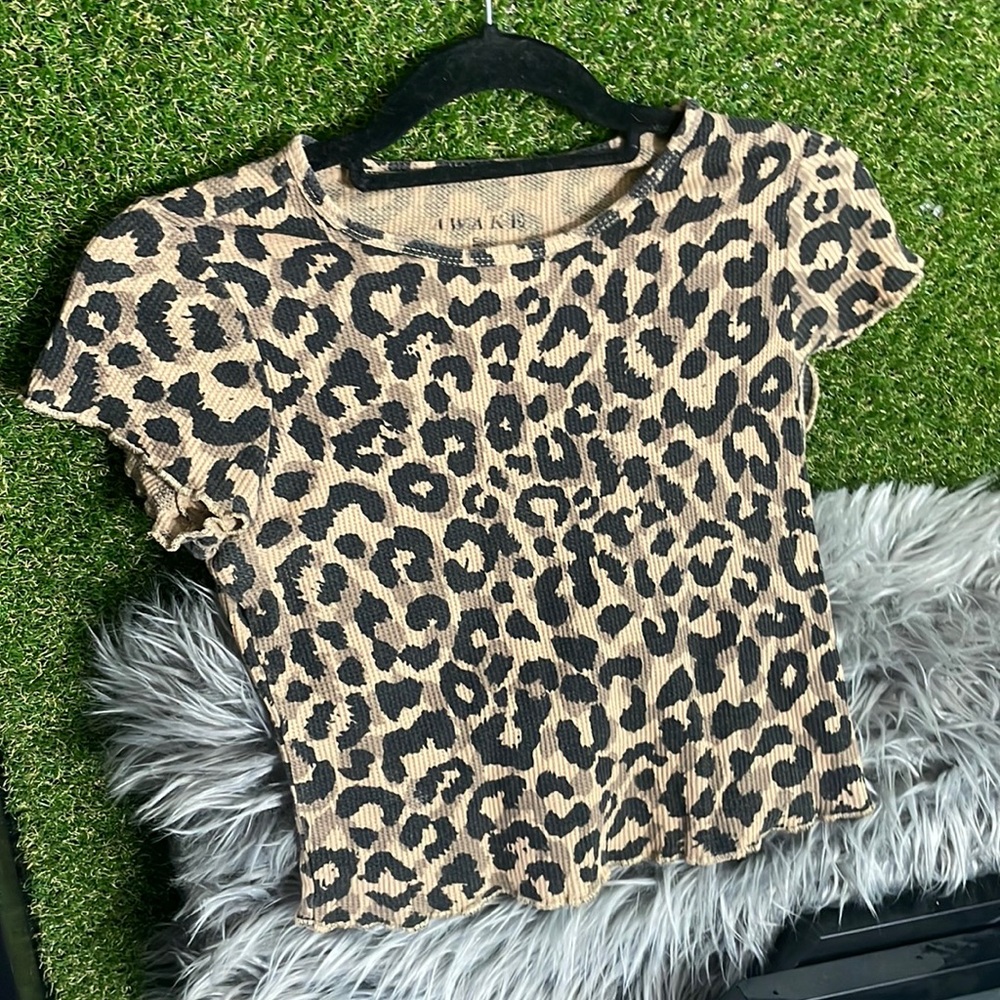 Brand-name, awake size small, shorter shirt